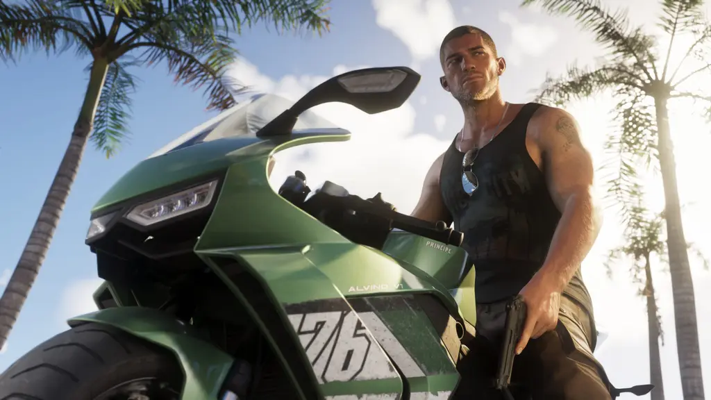 Jason Duval leaning on a green sport motorcycle under palm trees